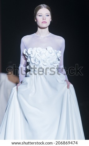 BARCELONA - MAY 09: a model walks on the Juana Martin bridal collection 2015 catwalk during the Barcelona Bridal Week runway on May 09, 2014 in Barcelona, Spain.