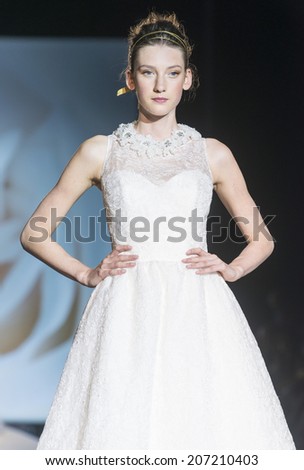 BARCELONA - MAY 07: a model walks on the Jesus Peiro bridal collection 2015 catwalk during the Barcelona Bridal Week runway on May 07, 2014 in Barcelona, Spain.