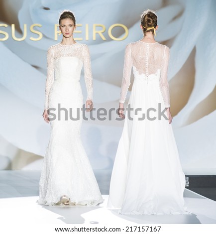 BARCELONA - MAY 07: models walking on the Jesus Peiro bridal collection 2015 catwalk during the Barcelona Bridal Week runway on May 07, 2014 in Barcelona, Spain.