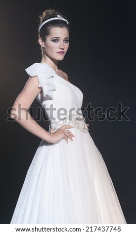 BARCELONA - MAY 08: a model walks on the Franc Sarabia bridal collection 2015 catwalk during the Barcelona Bridal Week runway on May 08, 2014 in Barcelona, Spain.
