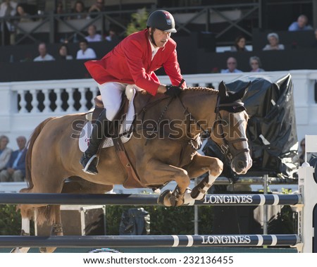 BARCELONA - OCTOBER 09: Yann Candele rider in action during the Furusiyya Jumping First Competition in Real Club Polo Barcelona, on October 09, 2014, Barcelona, Spain.