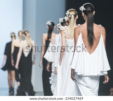 MADRID - SEPTEMBER 13: models walking on the Juana Martin catwalk during the Mercedes-Benz Fashion Week Madrid Spring/Summer 2015 runway on September 13, 2014 in Madrid.