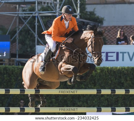 BARCELONA - OCTOBER 09: Jeroen Dubbeldam rider in action during the Furusiyya Jumping First Competition in Real Club Polo Barcelona, on October 09, 2014, Barcelona, Spain.