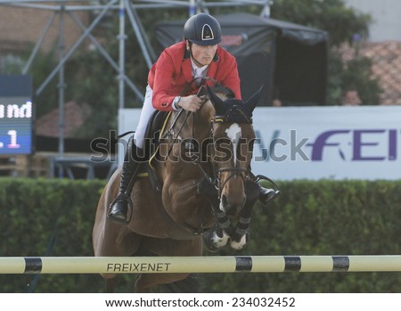 BARCELONA - OCTOBER 09: Lorenzo de Luca rider in action during the Furusiyya Jumping First Competition in Real Club Polo Barcelona, on October 09, 2014, Barcelona, Spain.