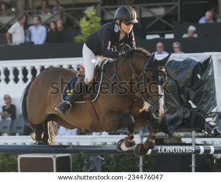 BARCELONA - OCTOBER 09: Malin Baryard-Johnsson rider in action during the Furusiyya Jumping First Competition in Real Club Polo Barcelona, on October 09, 2014, Barcelona, Spain.