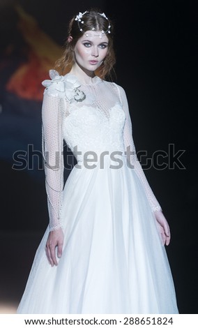 BARCELONA - MAY 06: a model walks on the Jesus Peiro bridal collection 2016 catwalk during the Barcelona Bridal Week runway on May 06, 2015 in Barcelona, Spain.