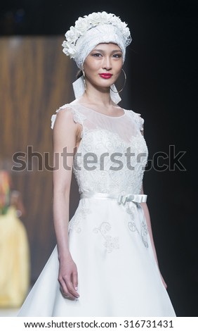 BARCELONA - MAY 07: a model walks on the Ana Torres bridal collection 2016 catwalk during the Barcelona Bridal Week runway on May 07, 2015 in Barcelona, Spain.
