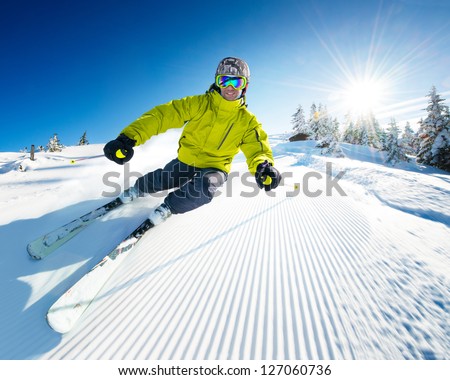 Skier On Piste In High Mountains