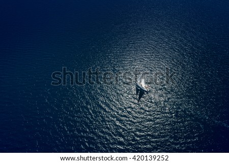 Amazing view to Yacht sailing in open sea at windy day. Drone view - birds eye angle. Yachting theme. Yachting background. Sailing time. Sailboat. Yacht. Luxury yacht.