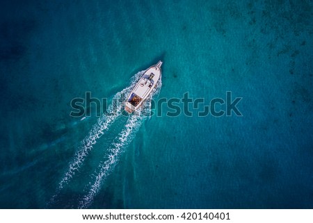Vintage wooden boat in coral sea. Vintage boat. Vintage Yacht. Yacht theme. Vintage theme. Vintage ship. Yacht background. Yacht drone view. Boat drone photo.