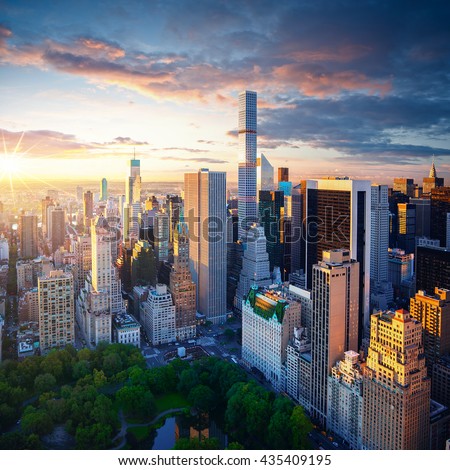 New York City Central Park at sunrise. New York background. New York City sunrise. New York Manhattan. New York colorful view. City of New York at cloudy sunrise.