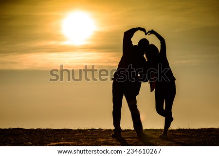Couple silhouette, sunrise photo of love