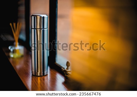 Thermo flask in the kitchen with decoration, Aluminum mug