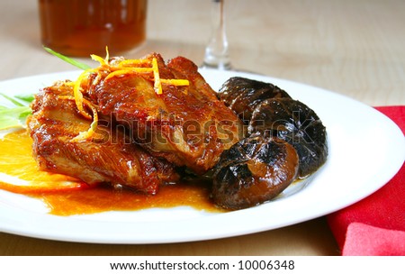 delicious plate of pork spare ribs with orange glaze sauce