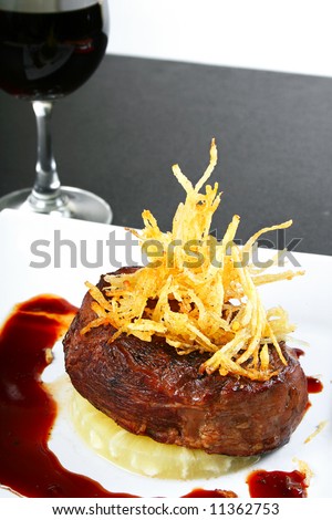 plate of tender beef steak with red wine