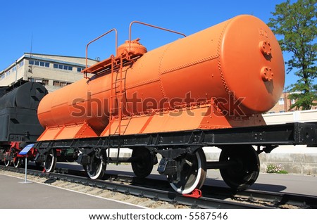 Orange railroad wagon waiting in the station
