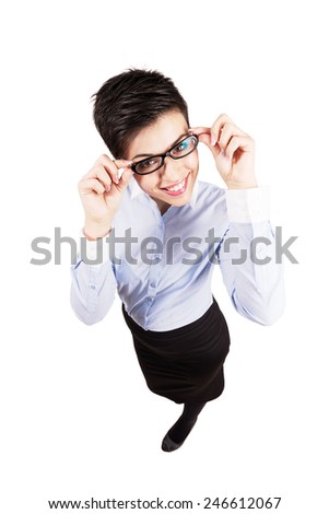 Young business woman holding eyeglasses smiling at camera. High angle view wide lens full body length portrait isolated over white background.