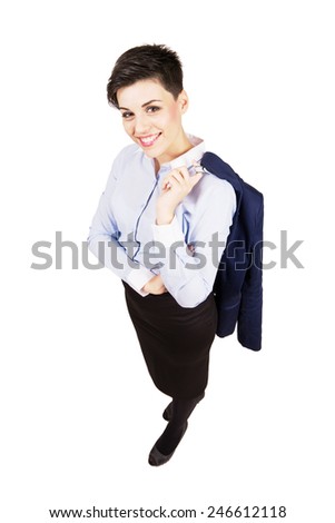 Young confident business woman holding jacket over the shoulder.  High angle view wide lens full body length portrait isolated over white background.