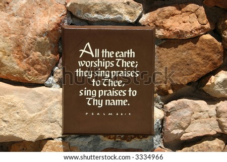 A plaque with a scripture text on it