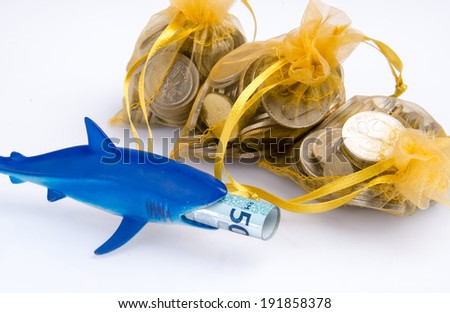 A loan shark concepts with three gold sheer pouch loaded with coins