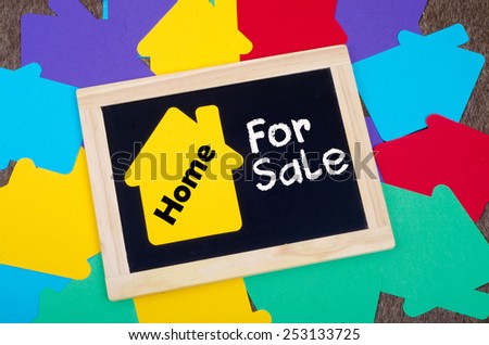 Yellow home sign on the blackboard: Real Estate Concept, Home for sale