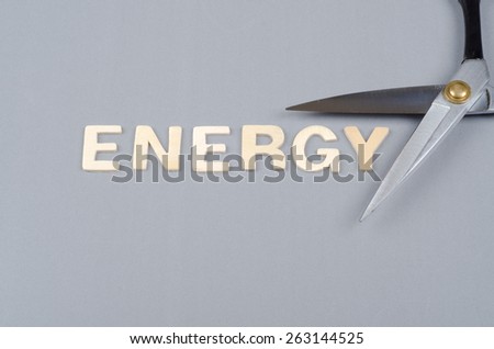 Save energy concept with text and scissor