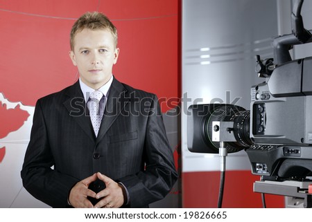 tv presenter in studio in front of the camera and viewers