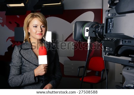 stand up transmission with serious smiling journalist woman in front of the video camera
