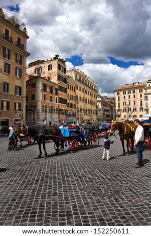 ROME, Italy - APRIL 16: Piazza di Spagna on April 16, 2012  in Rome Italy. The tourists are invited to take a city tour in a horse carriage