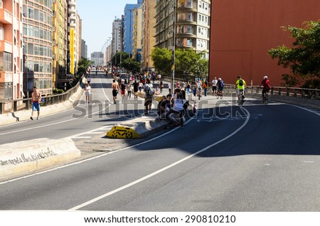 Sao Paulo, Brazil, June 14, 2015: People have fun in a high road, closed to cars on Sundays and holidays, in downtown Sao Paulo