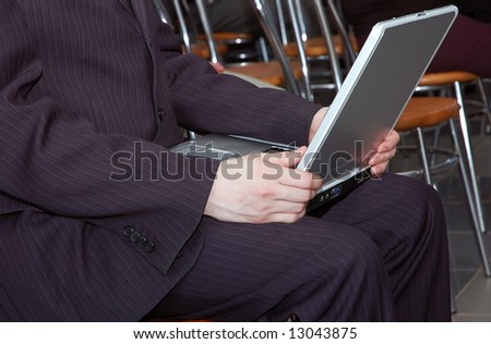 man working with portable computer as universal concept for many application