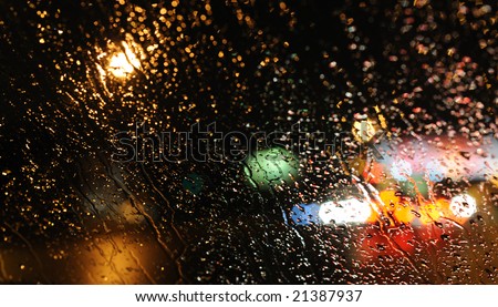stock photo Inside the car night rain and town lights background