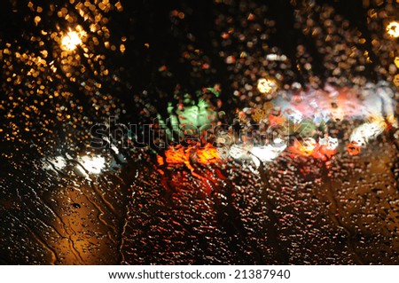 stock photo Inside the car night rain and town lights background