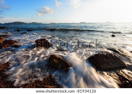Tidal wave on rocky shore