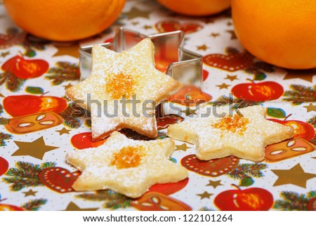 Christmas cookies with orange peel, stars made of biscuit dough with orange flavor