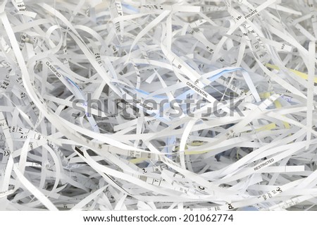 Cut into strips classified documents. Shredded documents.