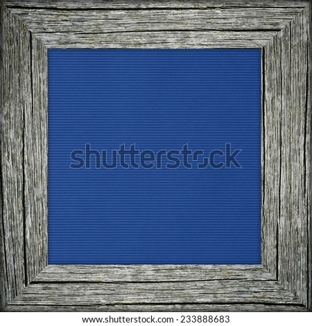 Old raw wooden frame with blue striped canvas