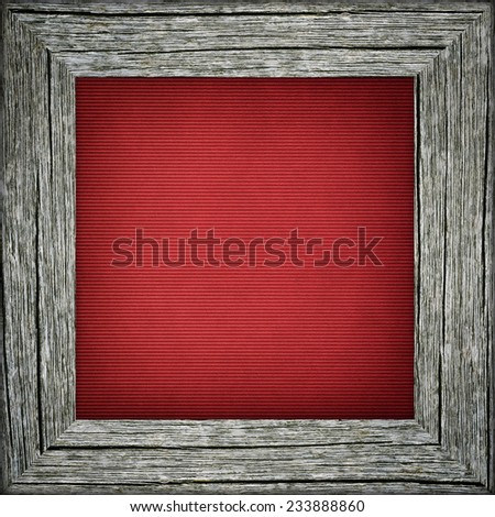Old raw wooden frame with red striped canvas