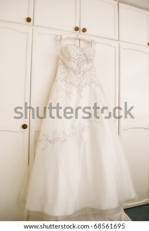 Beautiful wedding dress hanging up
