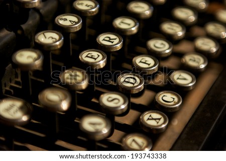 Close up photo of bronze vintage typewriter keys