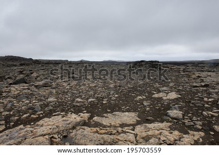 Empty and dead land, like from another planet, with dark and heavy clouds Iceland
