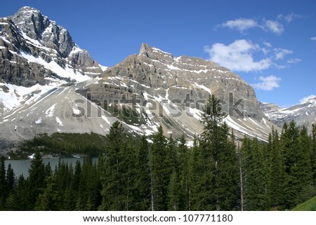 Jagged peaks of the Canadian Rockies rise majestically over Alberta province.