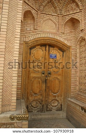 In northern China ornate mosques such as this one with a crafted wooden door and delicate masonry are a common sight