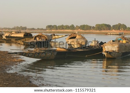 cargo dows on the NIger River of mali, wait for passengers to cross the river.