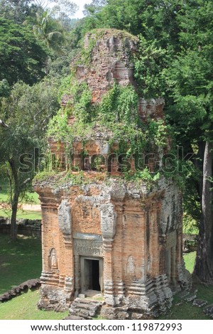 An overgrown sandstone temple in the jungle of Cambodia is a perfect example of architecture that predates that of Angkor