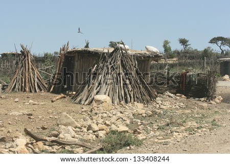 Nomad homes in the desert of Ethiopia appear to be nothing more than wood piles or logs