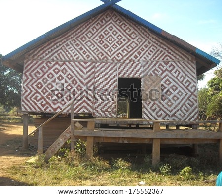 A colorfully decorated hut shows the intricate designs of the native peoples of the Amazon river basin in Peru