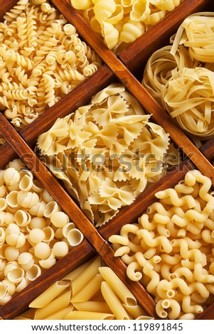Pasta mix in compartment wooden box - closeup