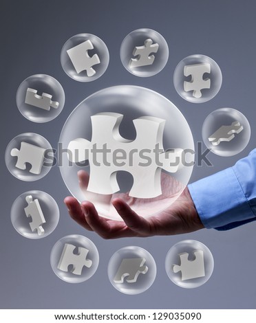 The key piece of a solution concept - puzzle pieces in glass bubbles