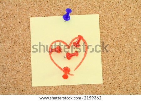 Corkboard with a love - hate message